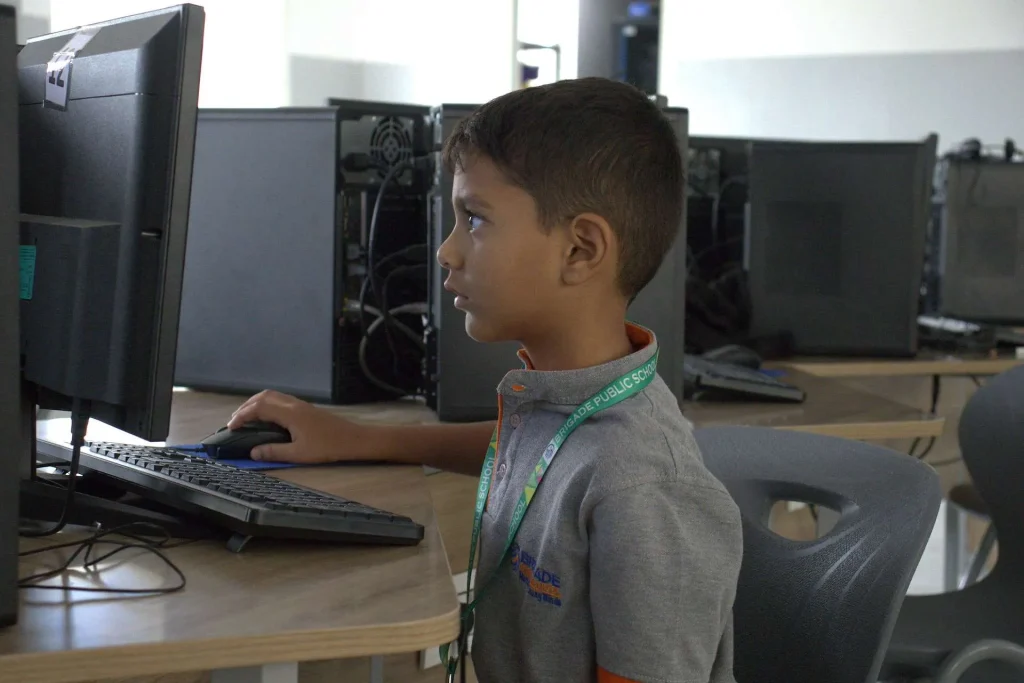 Student working in the computer lab at Brigade Public School, Gurramguda campus