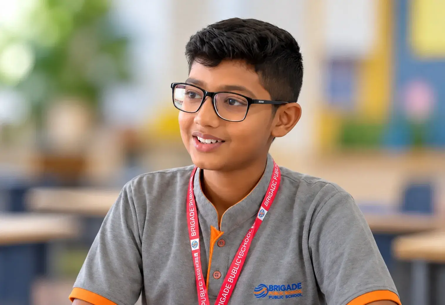 Smiling Student in Classroom Uniform